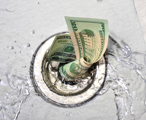 Image Source: https://www.istockphoto.com/photos/money-down-the-drain