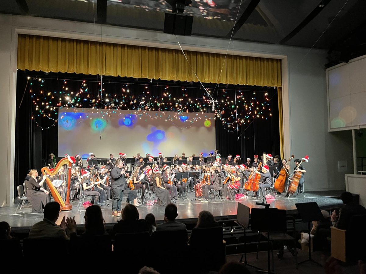 Student musicians and Director of Bands & Orchestras Christopher Noce prepare for the iconic festive performance of “Sleigh Ride” at PRISM 2023.